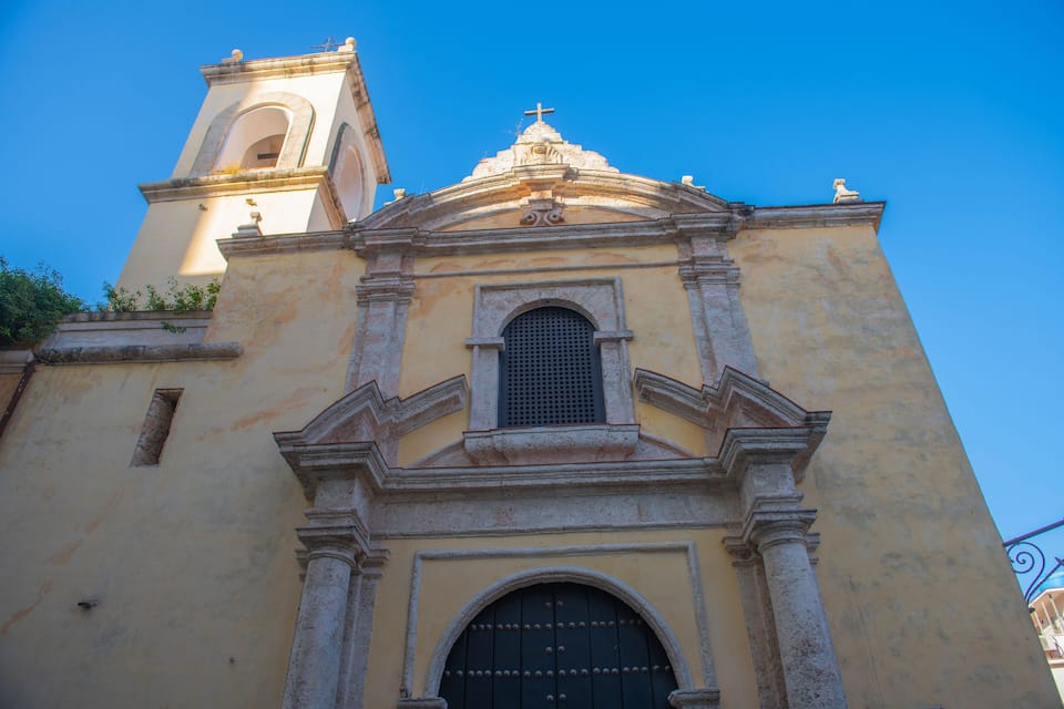 A church with a bell tower and a dome.