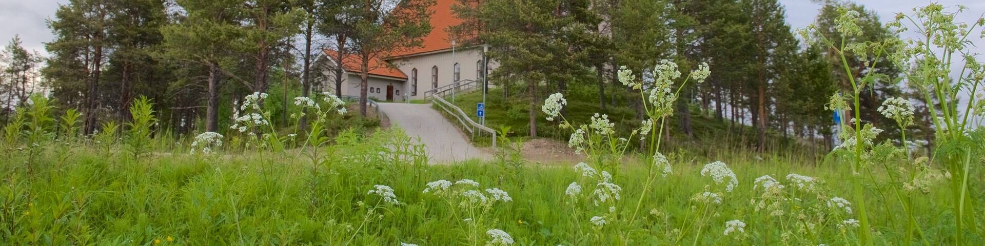 Enontekio Church which includes a park and a church or cathedral