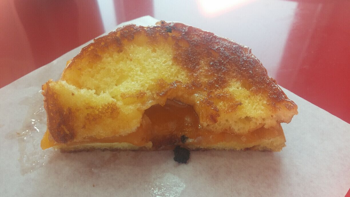 Grilled Cheese Doughnut!! A griddled glazed doughnut filled with cheddar cheese. Tom and Chee is a restaurant from Cincinnati that is expanding to the Columbus area. The menu starts with the basic Tomato Soup and Grilled Cheese combo and the creativity flares outward from there.