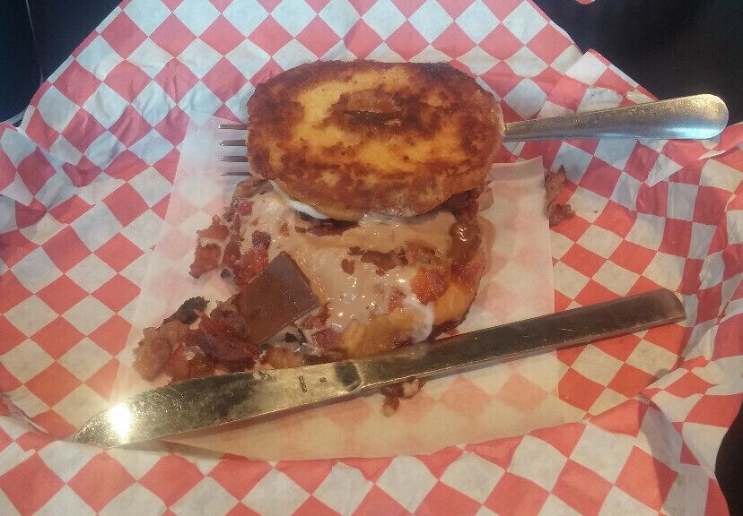 Fancy Grilled Cheese Donut!!  Out of this freaking world!! This jam here is the Choco-Bacon Bliss. A glazed donut sliced in half and placed on the griddle forms the base of this sandwich. Then. it's filled with mozzarella, bacon, chocolate marscapone and pieces of a Hershey's chocolate bar!