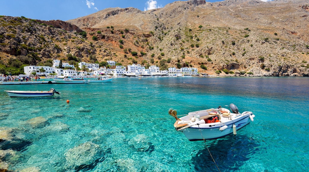 Small motorboat at clear water bay of Loutro town on Crete island, Greece