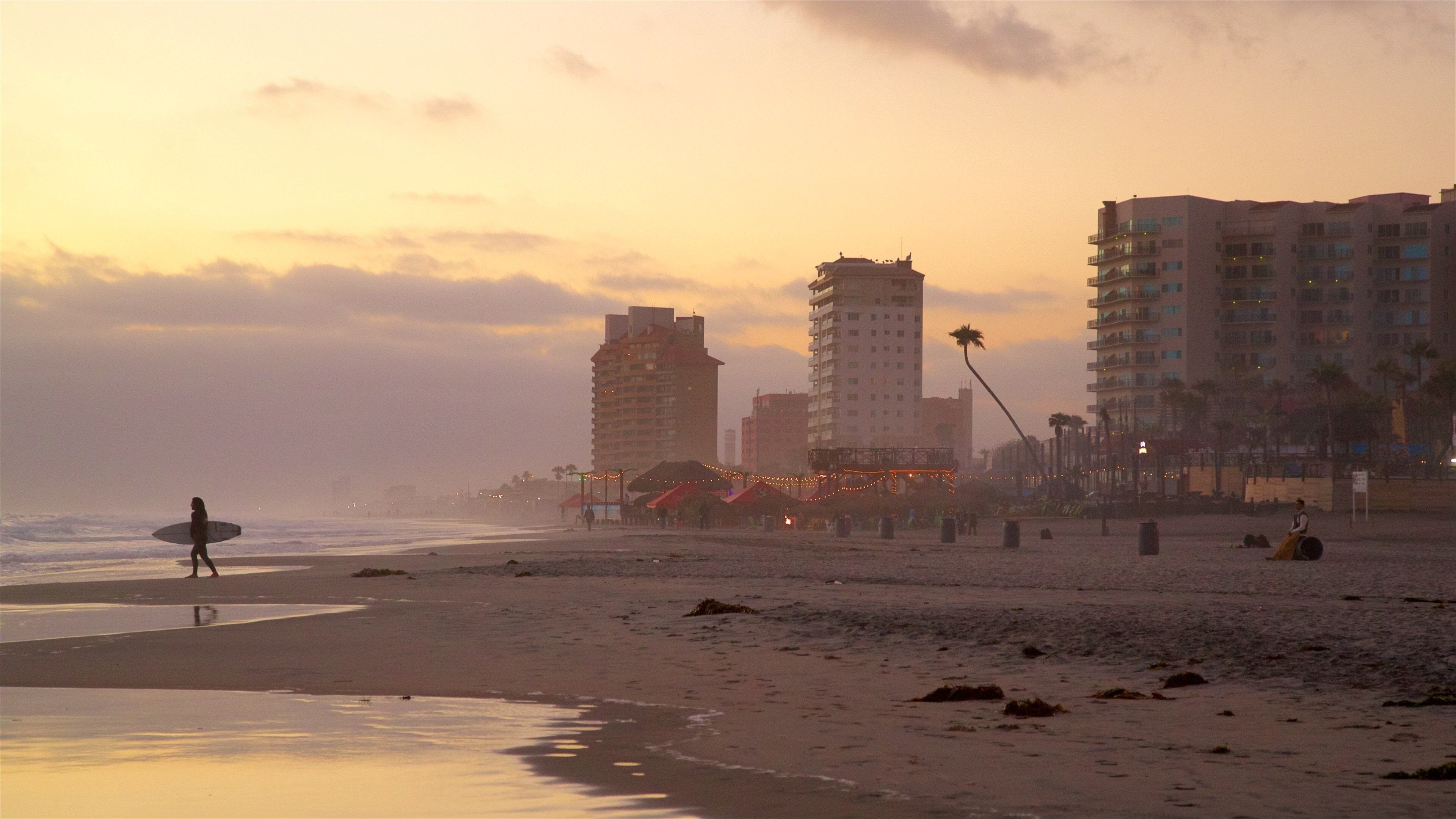 Rosarito Beach showing general coastal views, a sunset and a beach