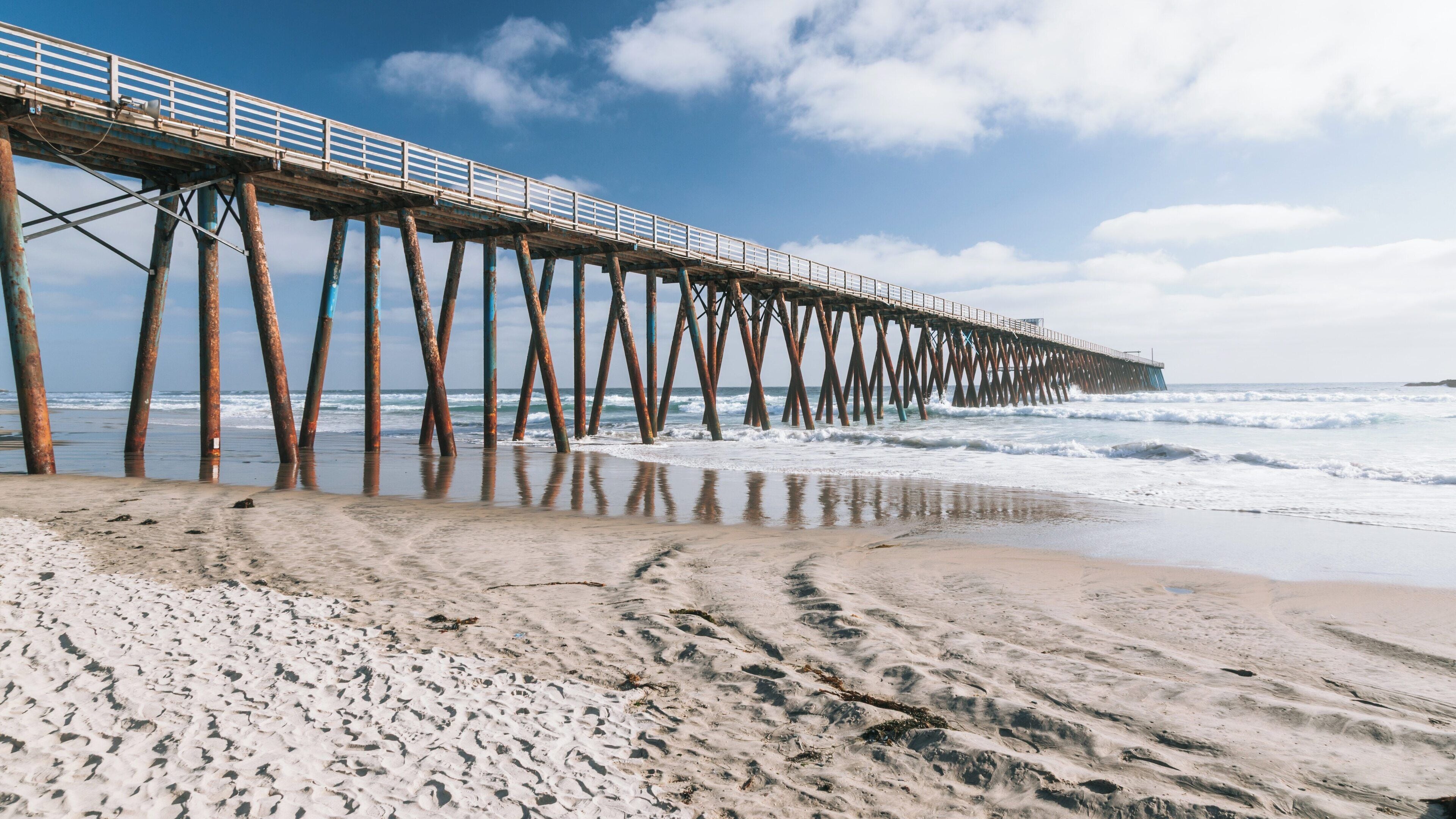 Exploring the beauty of Rosarito Beach and its iconic pier on a sunny day in Baja California, Mexico