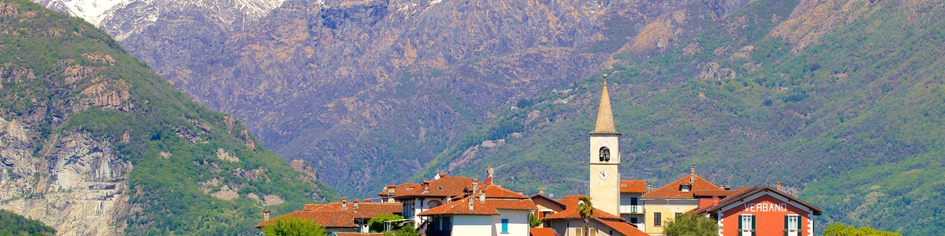 Isola dei Pescatori which includes mountains, a lake or waterhole and a small town or village