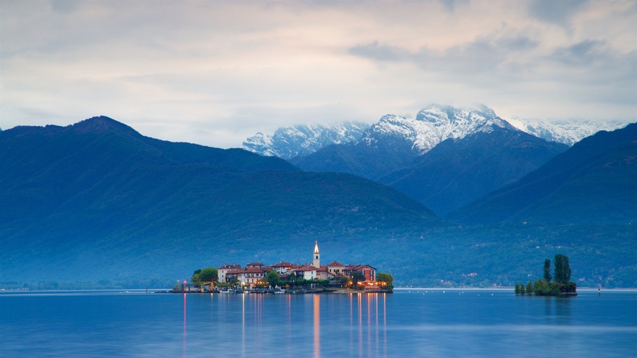 Isola dei Pescatori which includes a lake or waterhole, a small town or village and mountains