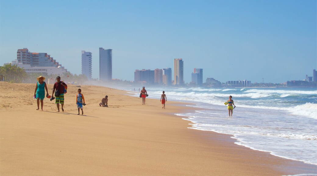 Witches Beach showing a sandy beach and surf as well as a family