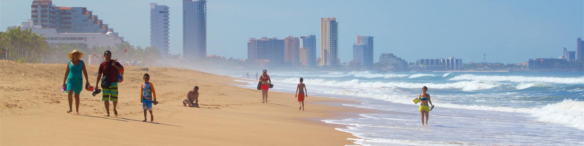 Witches Beach showing a sandy beach and surf as well as a family