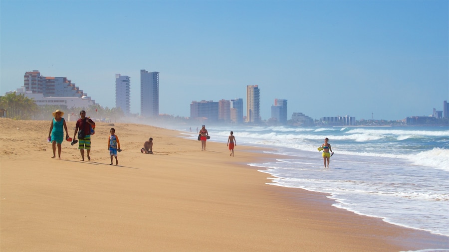 Witches Beach showing a sandy beach and surf as well as a family