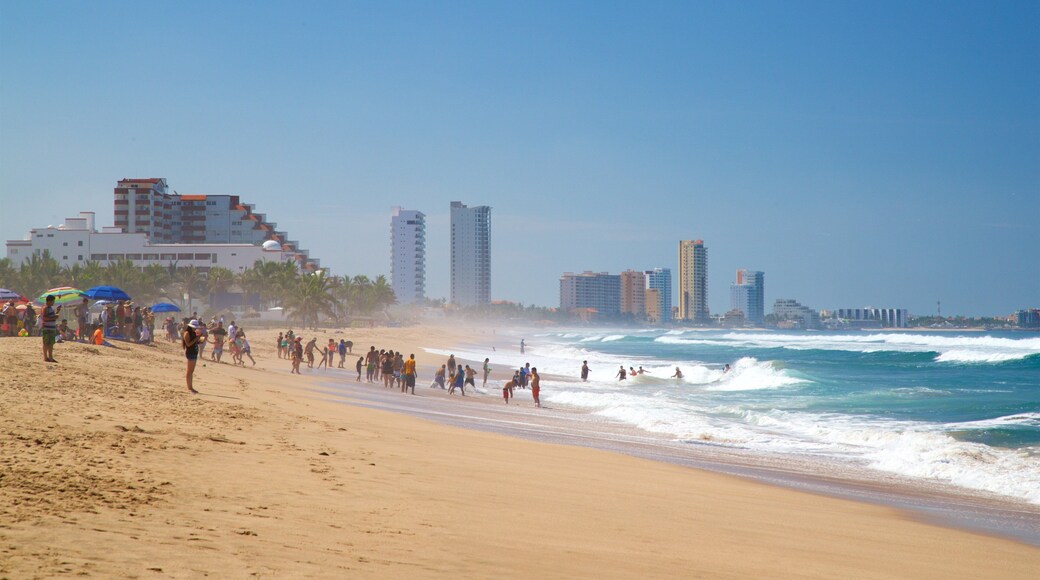 Witches Beach showing general coastal views and a sandy beach as well as a small group of people