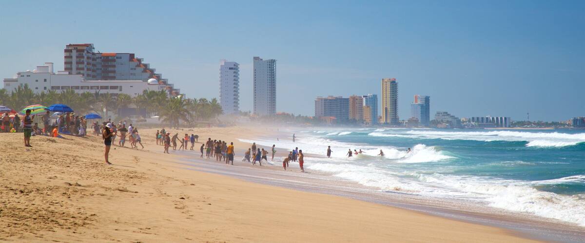 Witches Beach showing general coastal views and a sandy beach as well as a small group of people