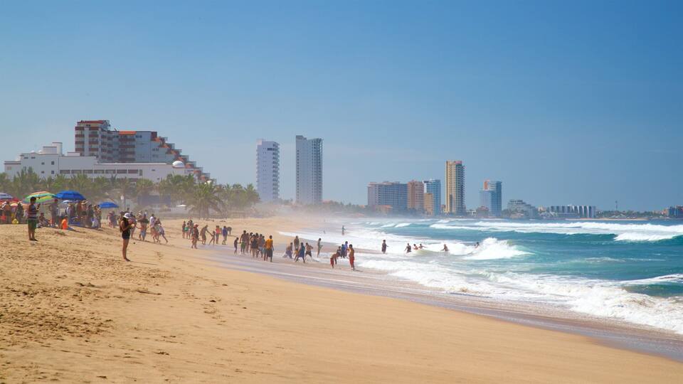 Witches Beach showing general coastal views and a sandy beach as well as a small group of people