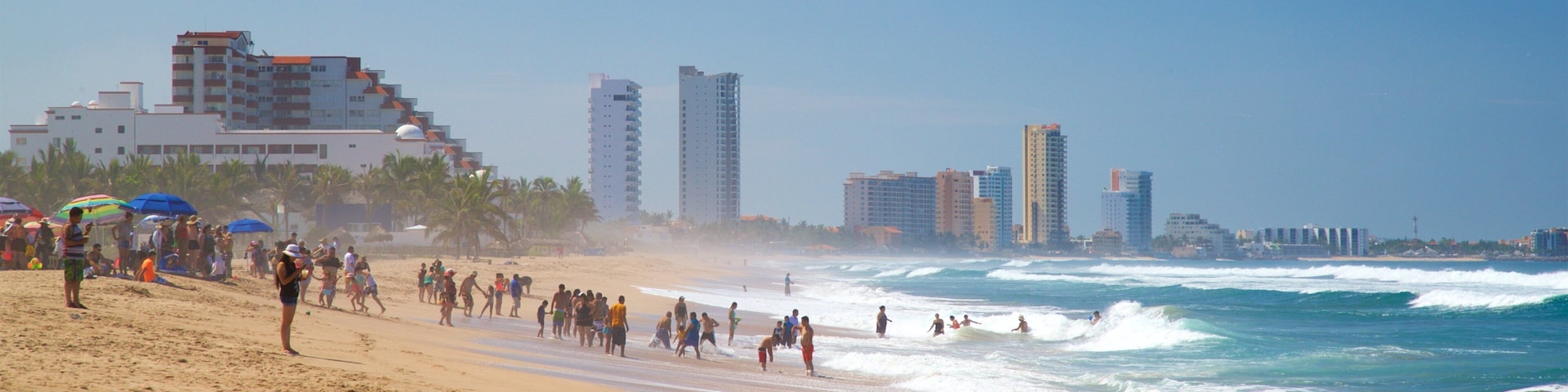 Witches Beach showing general coastal views and a sandy beach as well as a small group of people