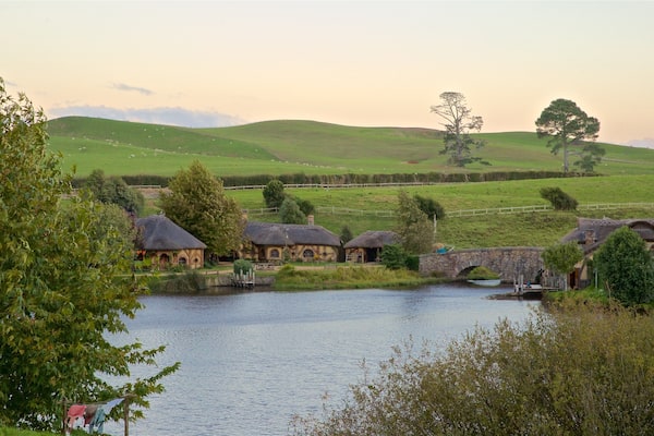 Hobbiton Movie Set featuring a sunset, landscape views and tranquil scenes