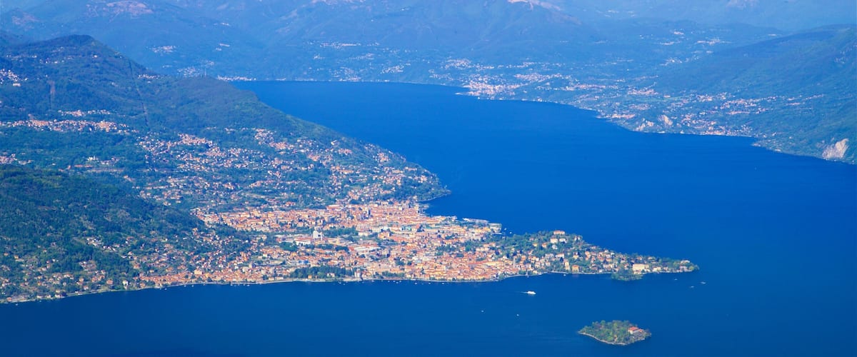A coastal city with a large body of water, surrounded by mountains and islands.