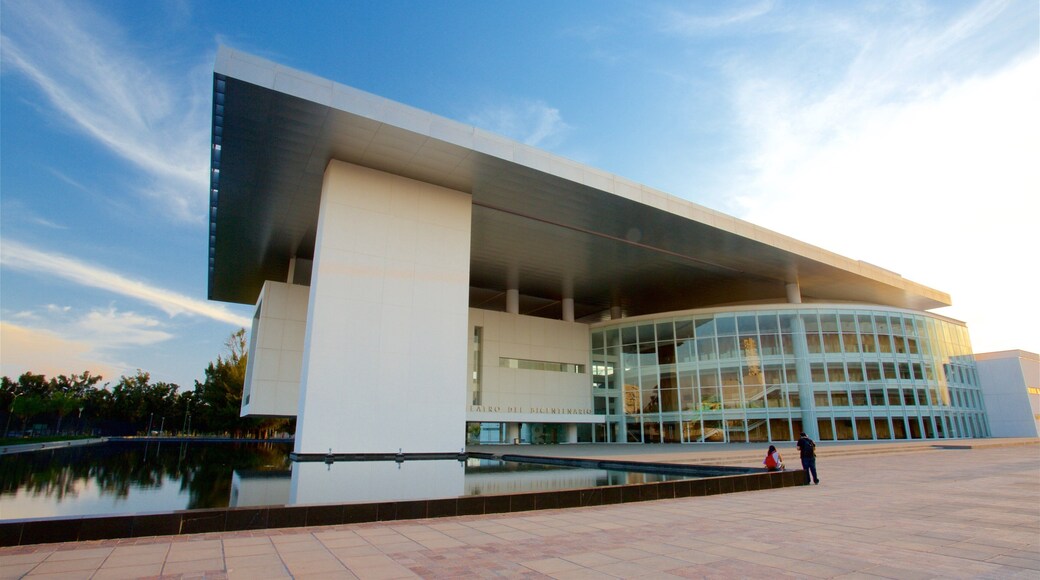 Bicentennial Theatre which includes a square or plaza, modern architecture and a lake or waterhole