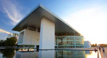 Bicentennial Theatre showing a square or plaza, modern architecture and a lake or waterhole