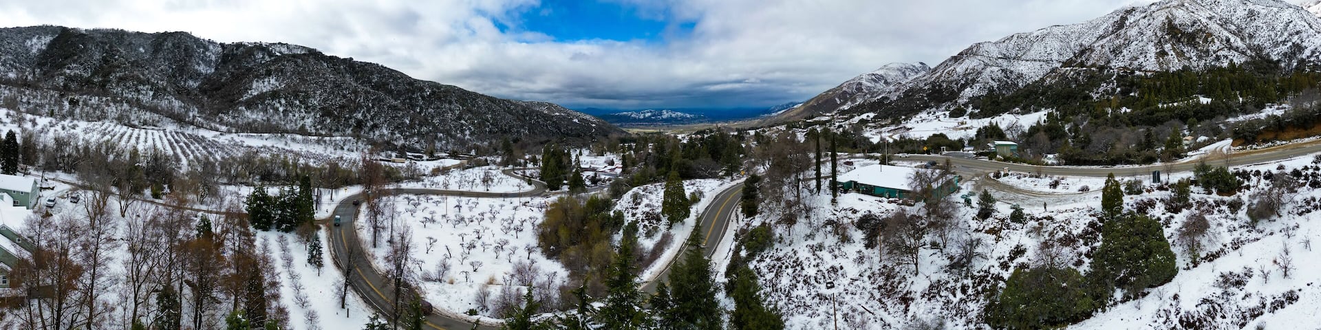 A UAV Drone Aerial Panoramic View of Oak Glen, California, after a major Winter Storm with Snow on the Ground