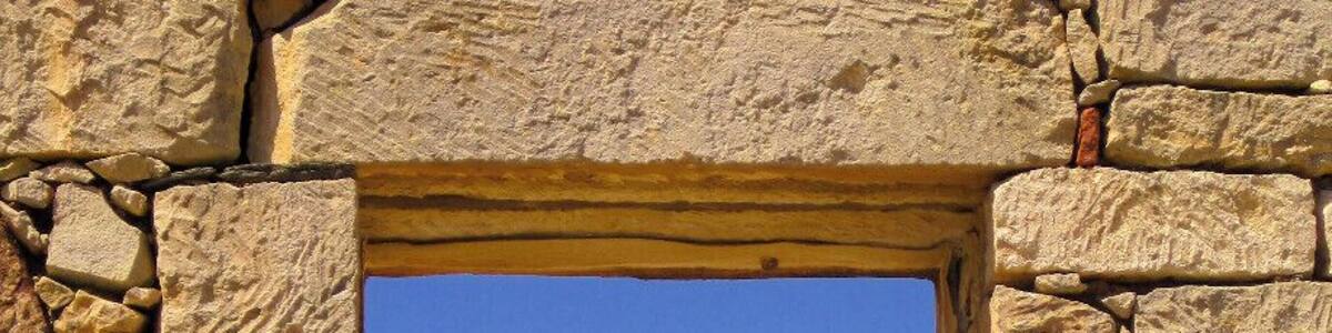 Chorio Village Kimolos: Chorio (or Chora) is the capital of Kimolos, located on the foot of Mount Xaplovouni. Chorio is found in the southeastern part of Kimolos. Kimolos has a sparse population and most of its inhabitants are concentrated there. In Chorio, you can see the typical Cycladic stone houses, narrow cobbled streets and a sense of an old charm prevailing all over. Many old buildings have been restored and new roads are being constructed to make it easier for tourists and residents. The best feature of Chorio is its traditional architecture: white washed houses with blue windows and flowered yards, which are built around the center of the old Venetian Castle. These houses portray true Aegean architectural style. The castle has two parts: Messa Kastro or the Inner Castle and Exo Kastro or the Outer Castle. They are also known as Palio Horio or Old Village and Neo Horio or New Village. In Messa Kastro, the outer walls of the houses have loopholes for windows, forming a defending wall.