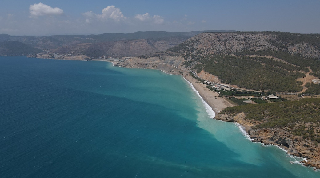 Aerial shot of a blue sea in Yanisli Cave Beach, Gulnar, Mersin, Turkey
