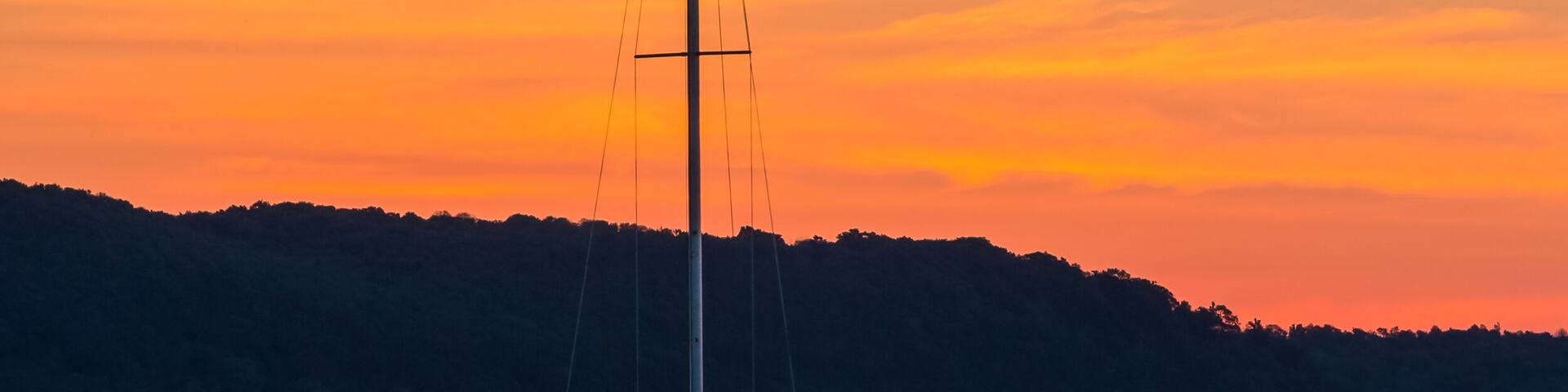 Sailboat on Lake at Daybreak