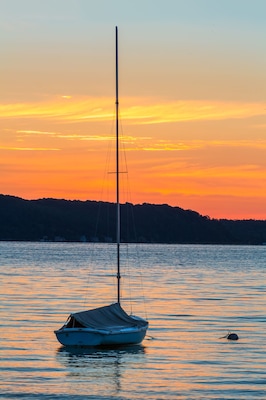 Sailboat on Lake at Daybreak
