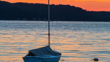 Sailboat on Lake at Daybreak