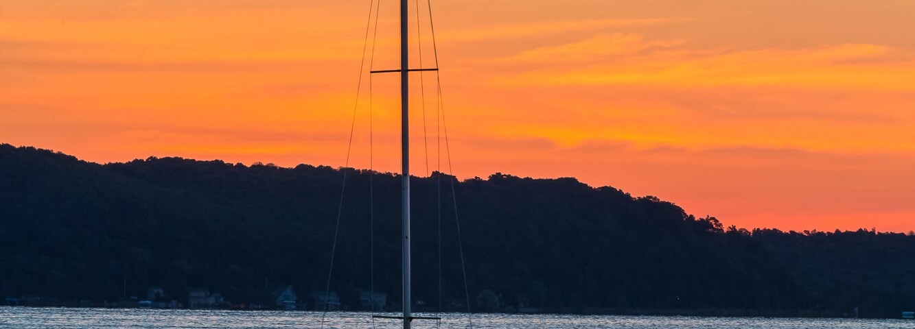 Sailboat on Lake at Daybreak