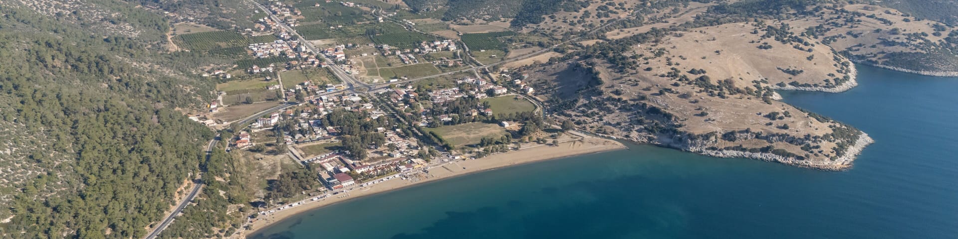 Aerial view over Ahmetbeyli coastal resort town in Menderes district of Izmir province in Turkey.