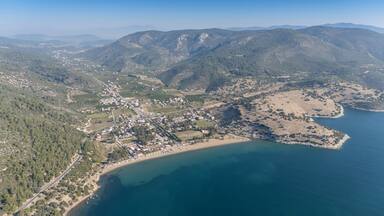 Aerial view over Ahmetbeyli coastal resort town in Menderes district of Izmir province in Turkey.