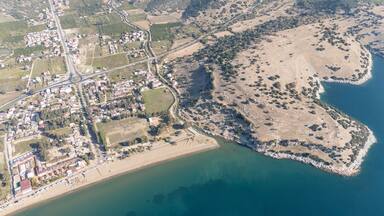 Aerial view over Ahmetbeyli coastal resort town in Menderes district of Izmir province in Turkey.