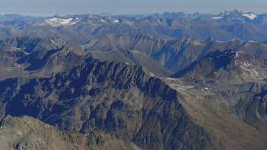 A rugged mountain range with sharp peaks and deep valleys.