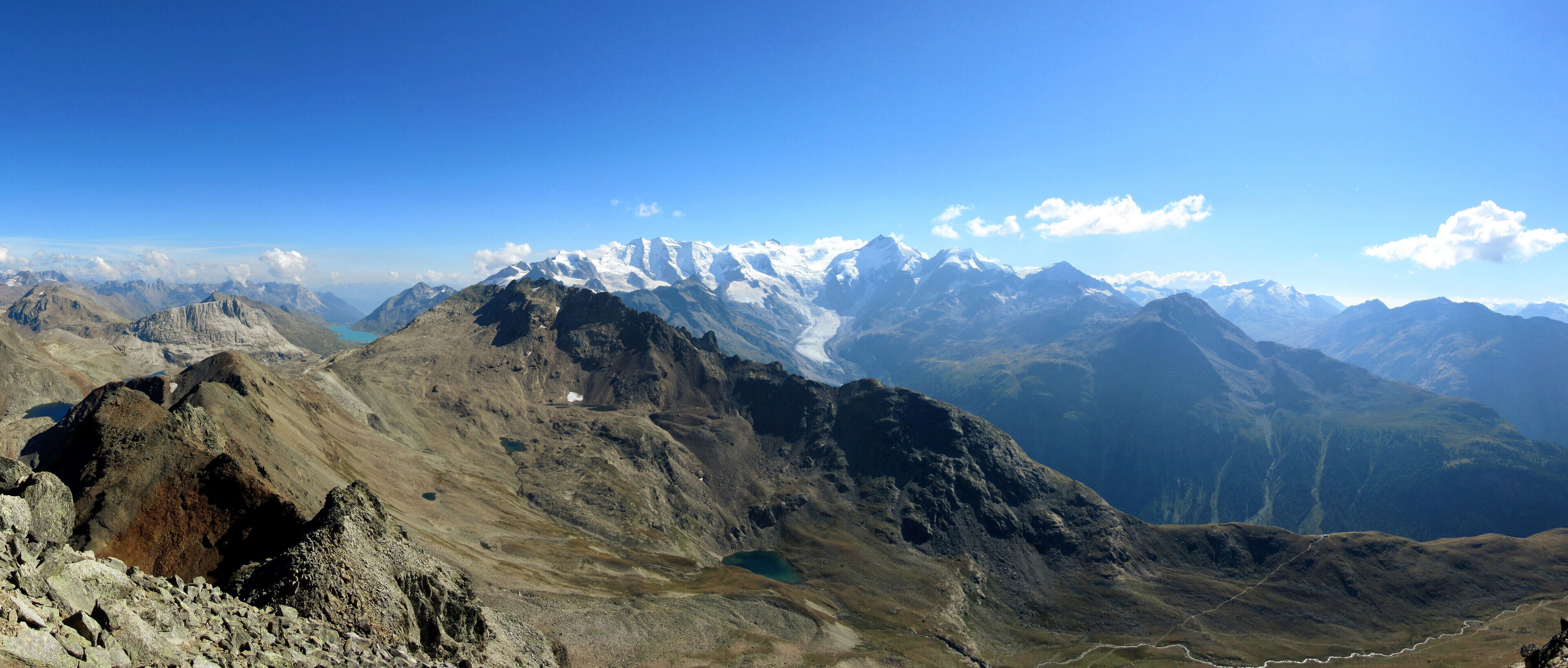 Northside of Piz Albris, seen from Piz Languard. Lake in the background is Lage Bianco, mountains in the Background is Bernina Range and Morteratsch Glacier.