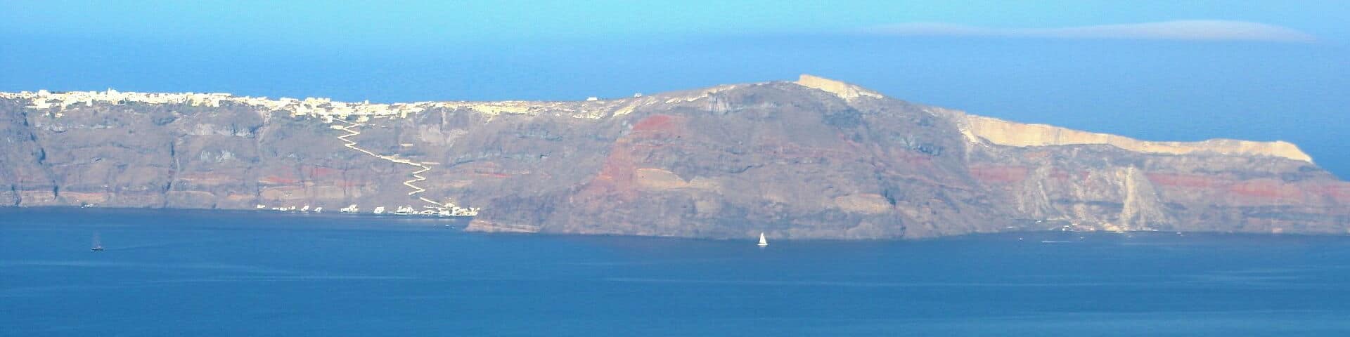 This is the view of a nearby Island In Santorini called Thirasia, An island in the northwest of Nea Kameni. It Got separated from Thera after the devastating volcanic eruption ages ago. #endlesssummer