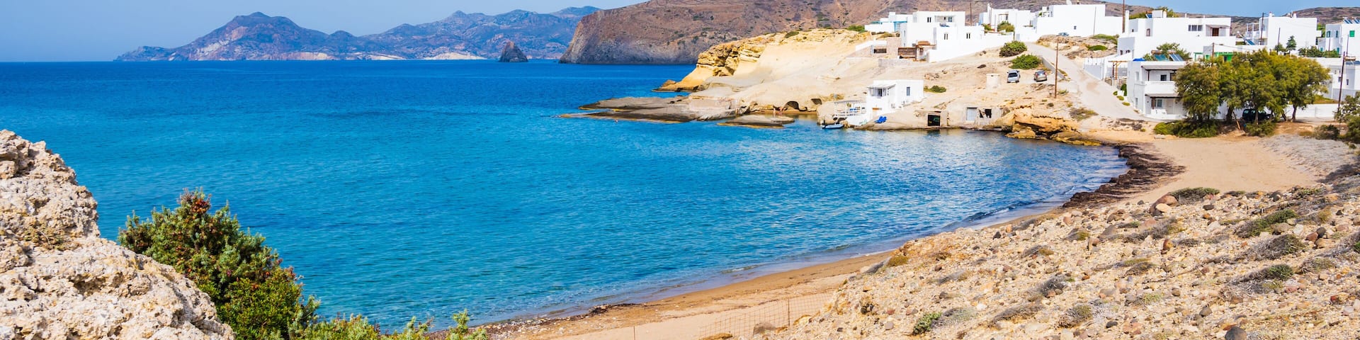 View of beautiful sandy Pachena beach with azure sea water, Milos island, Cyclades, Greece