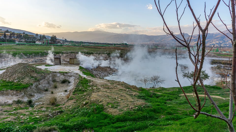 cenic views of thermal springs and mud bath in Sarayköy which contains bicarbonates and sulfates and power plant producing electricity from the geothermal steam, Denizli, Turkey