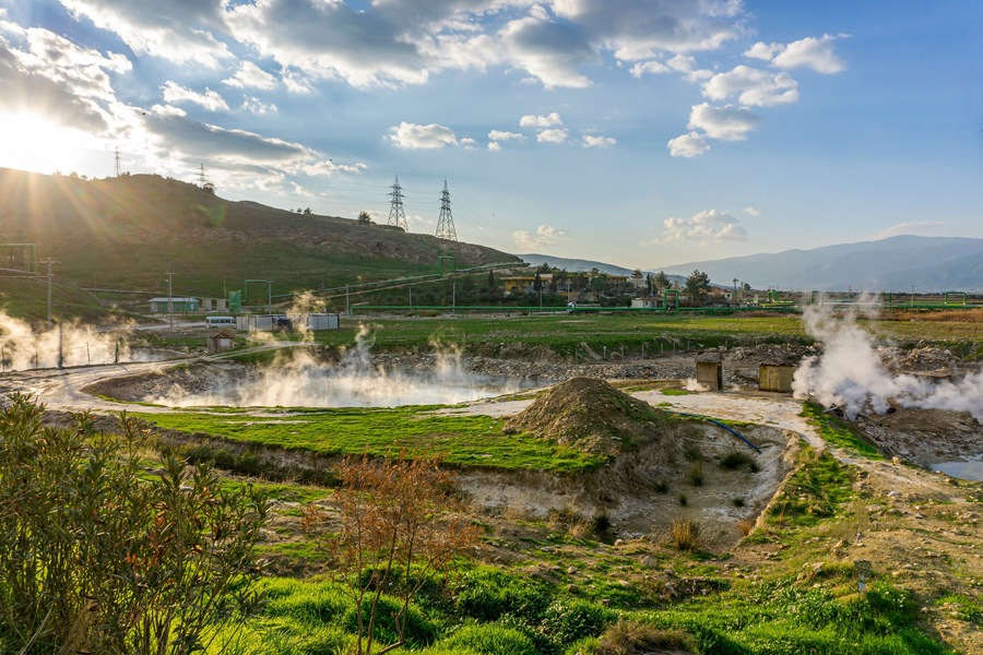 cenic views of thermal springs and mud bath in Sarayköy which contains bicarbonates and sulfates and power plant producing electricity from the geothermal steam, Denizli, Turkey
