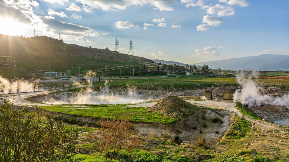 cenic views of thermal springs and mud bath in Sarayköy which contains bicarbonates and sulfates and power plant producing electricity from the geothermal steam, Denizli, Turkey