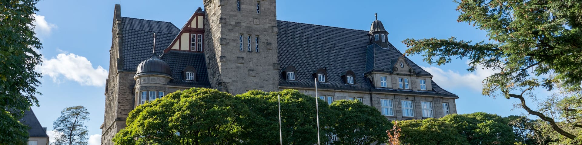 Town hall in Wittenberge, Barndenburg, Germany with blue sky and white clouds