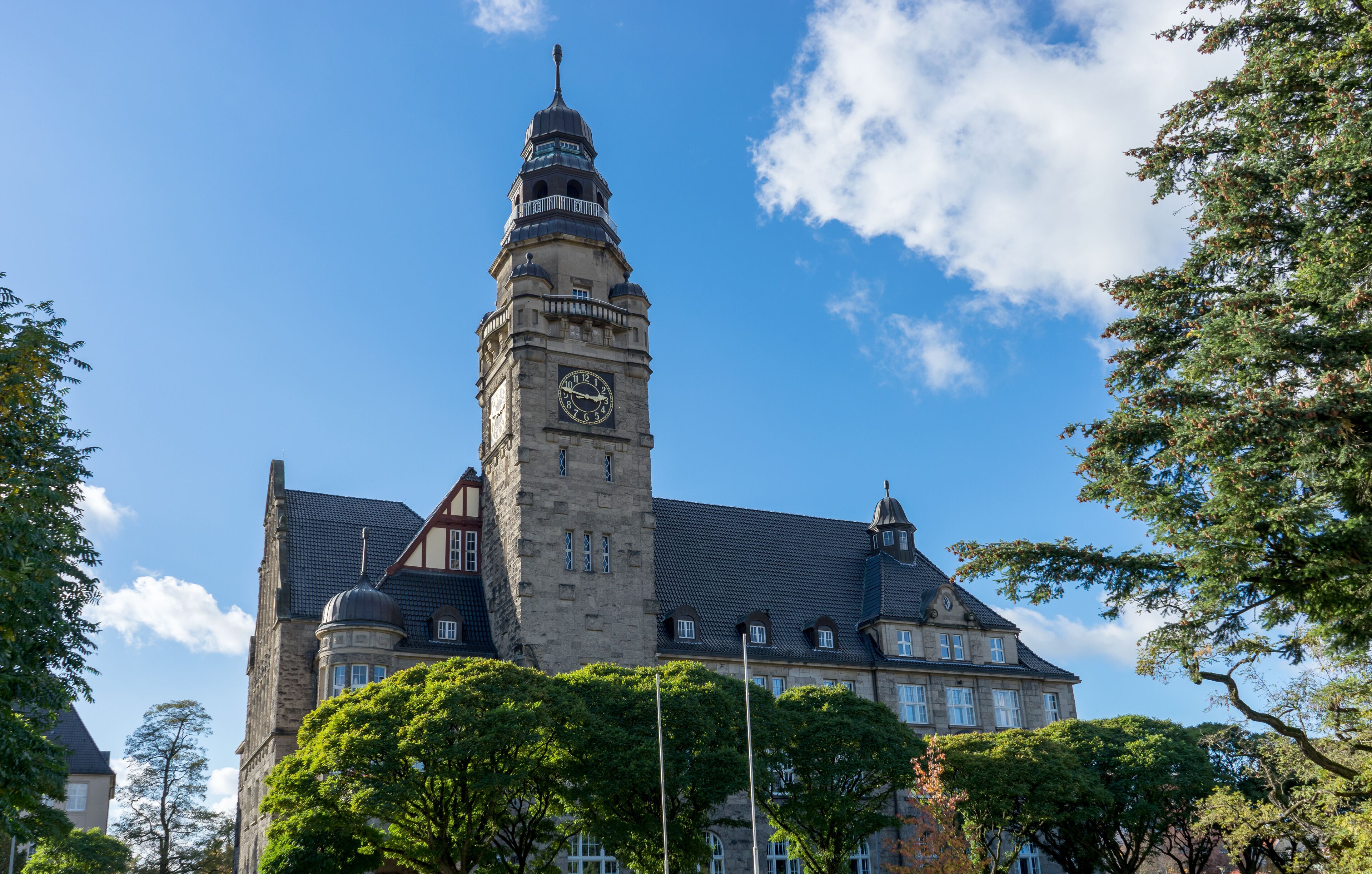 A historic building with a prominent clock tower and a large clock face.