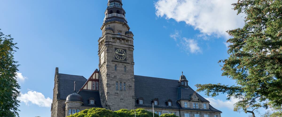 A historic building with a prominent clock tower and a large clock face.