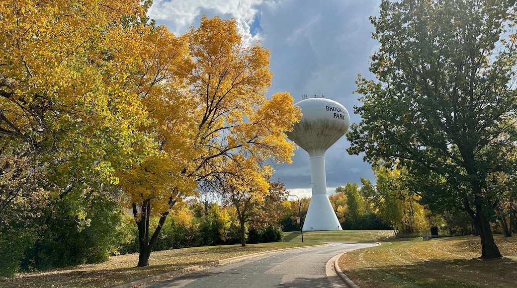 Brooklyn Park Minnesota water tower, surrounded by fall foliage in autumn