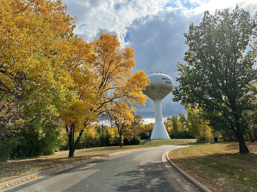 Brooklyn Park Minnesota water tower, surrounded by fall foliage in autumn