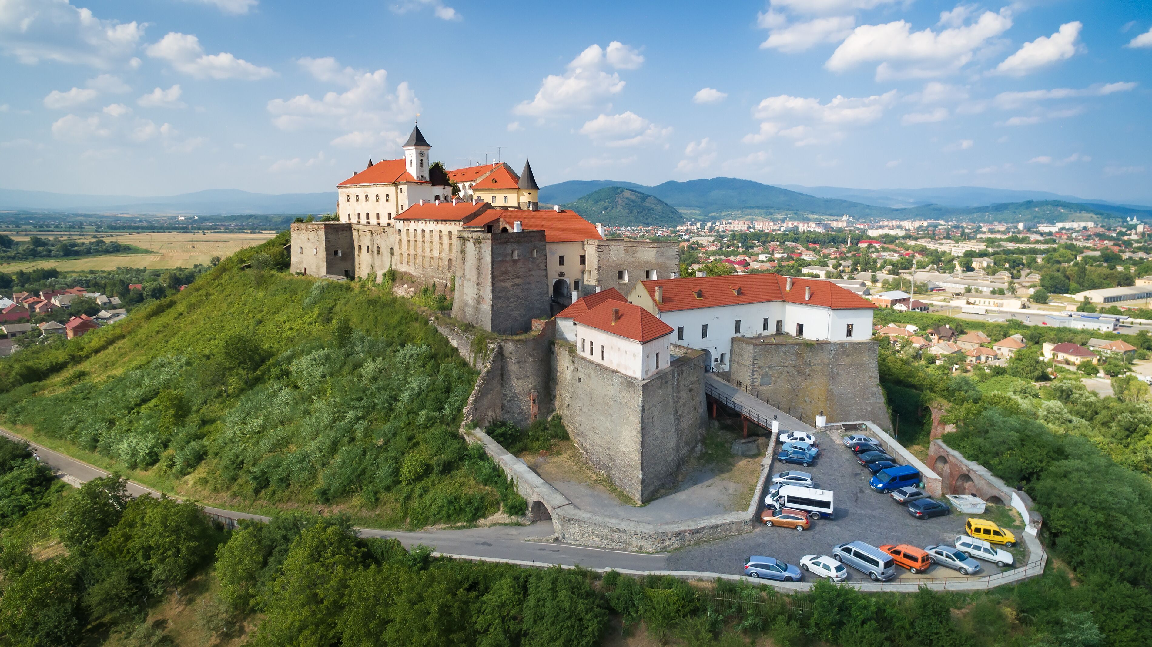 Aerial view on the ancient castle of Palanok and the foothills of Carpathians Mountains