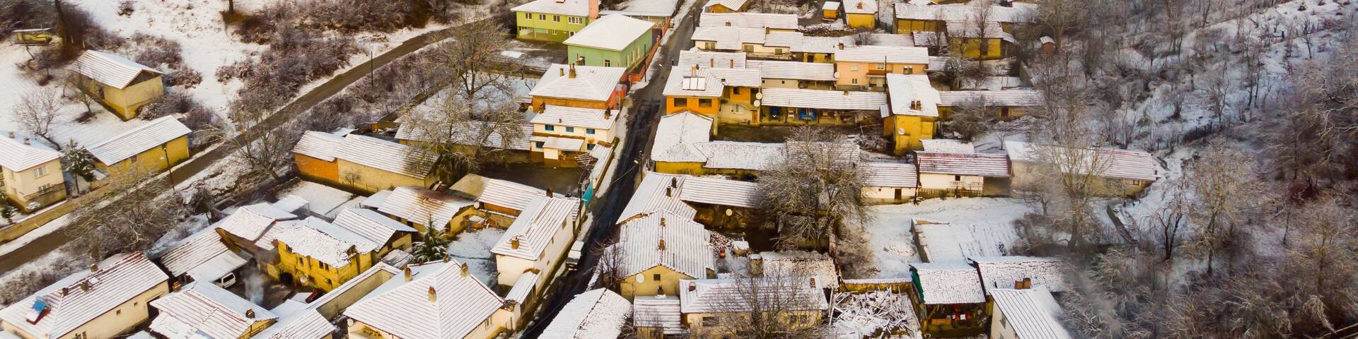 Scenic aerial view of typical Turkish mountainous village of Muratdere covered with snow on winter day, District of Bozuyuk, Bilecik Province
