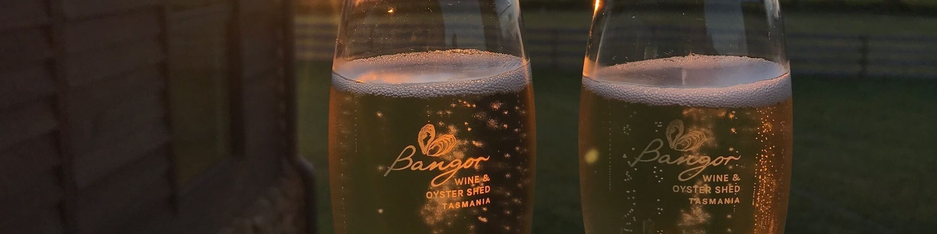 Enjoying a glass of sparkling at sunset at Bangor Wine & Oyster Shed in Dunalley. It's amazing to be able to see the vineyard where the grapes are grown from our seat on the deck. Beyond the vineyard is the ocean, and in it the oyster lease where the oysters are collected daily - total paddock to plate experience #foodiefinds