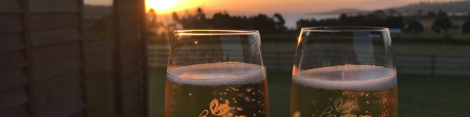 Enjoying a glass of sparkling at sunset at Bangor Wine & Oyster Shed in Dunalley. It's amazing to be able to see the vineyard where the grapes are grown from our seat on the deck. Beyond the vineyard is the ocean, and in it the oyster lease where the oysters are collected daily - total paddock to plate experience #foodiefinds