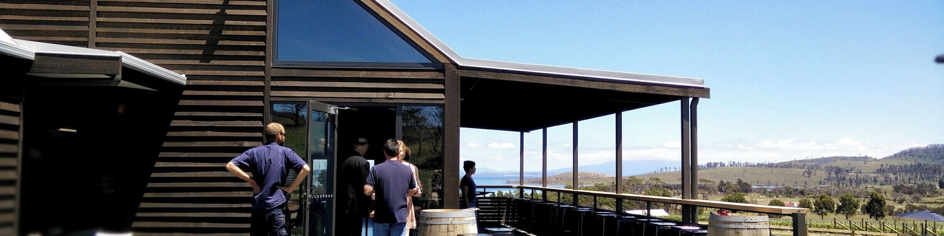 Just 45 minutes from Hobart, Dunalley is a small town by the sea with a canal and swing bridge separating it from the Tasman Peninsula. 
Affected but also in a way spared from annihilation which could have befallen them in the disastrous fires that roared through the area in January 2013,   Bangor Wine & Oyster Shed sits above the town, overlooking Bangor Vineyard, Blackman Bay, Marion Bay and Norfolk Bay where some of Australia's best oysters are grown.
Now it is a stop on the way to or from Port Arthur or a retreat after work on Friday nights when it is open in summer until 9.00pm. Award winning wines, cheese & antipasto platters and dishes of the day plus great coffee make this one of my favourite weekend call-bys.
Visit their site: http://www.bangorshed.com.au