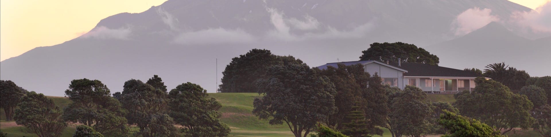Fitzroy Beach which includes mountains, tranquil scenes and a sunset