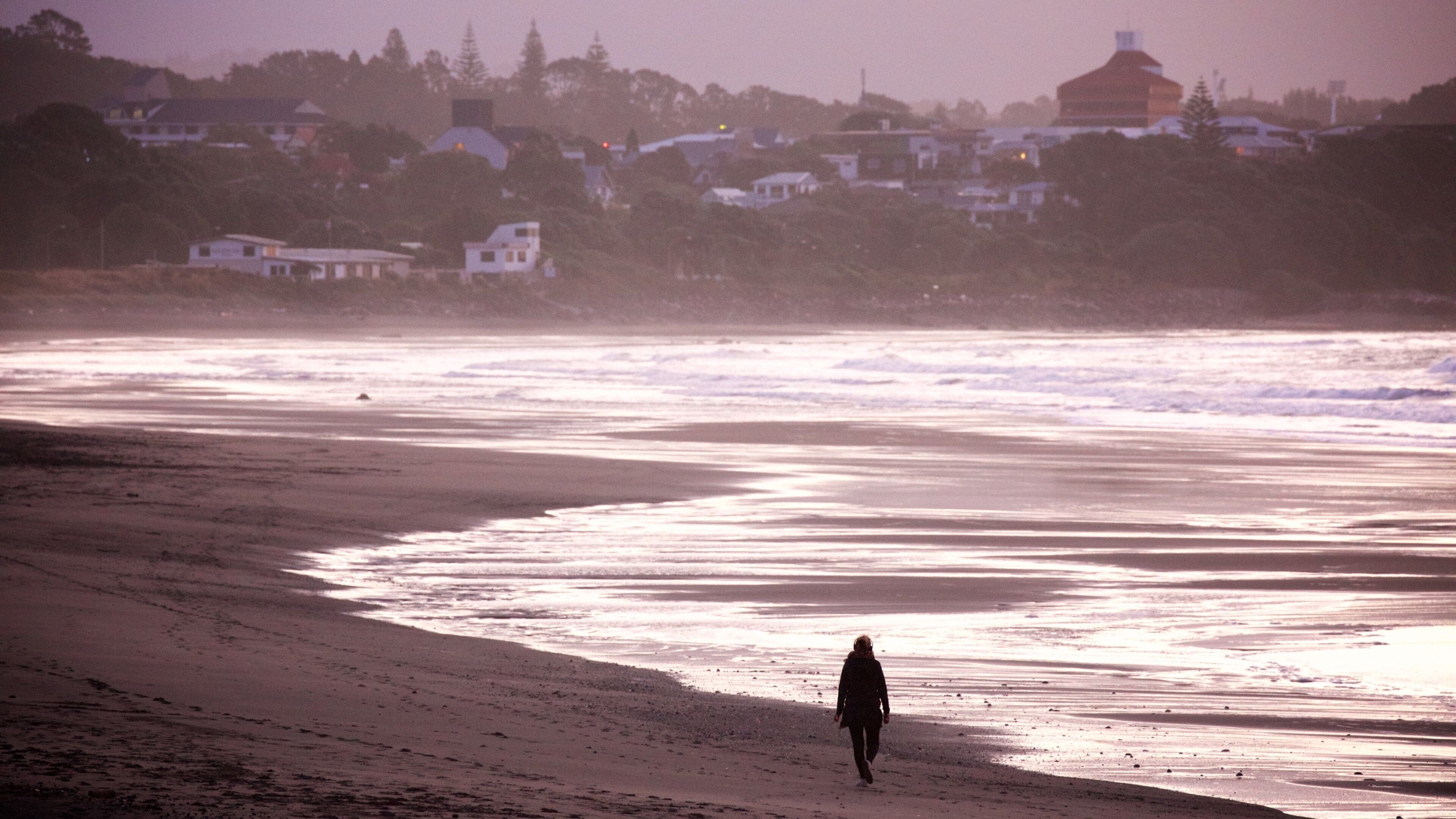Fitzroy Beach featuring surf, a coastal town and a bay or harbor