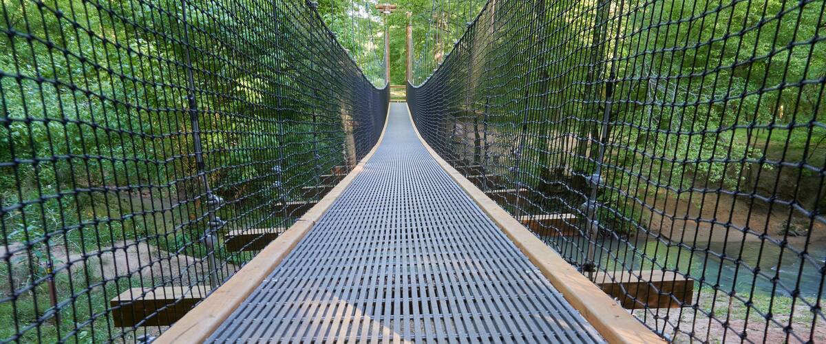 FORT MILL, SOUTH CAROLINA/UNITED STATES – APRIL 27, 2019: Suspension bridge at Anne Springs Close Greenway in Fort Mill, South Carolina.